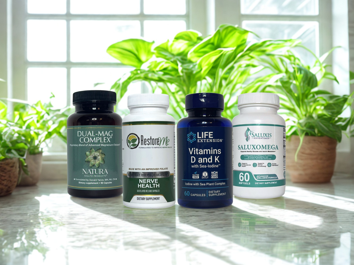 Supplement bottles on a reflective surface with plants in the background