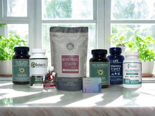 Assorted health supplements and teas on a windowsill with plants in the background